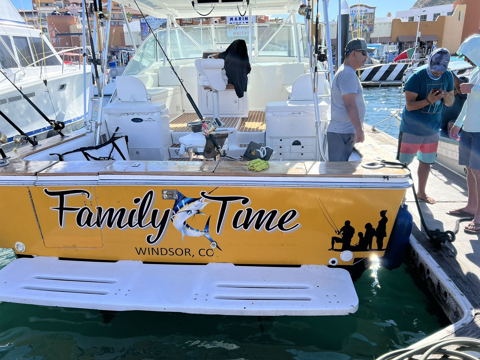 Family Time stern with the Cabo marina behind
